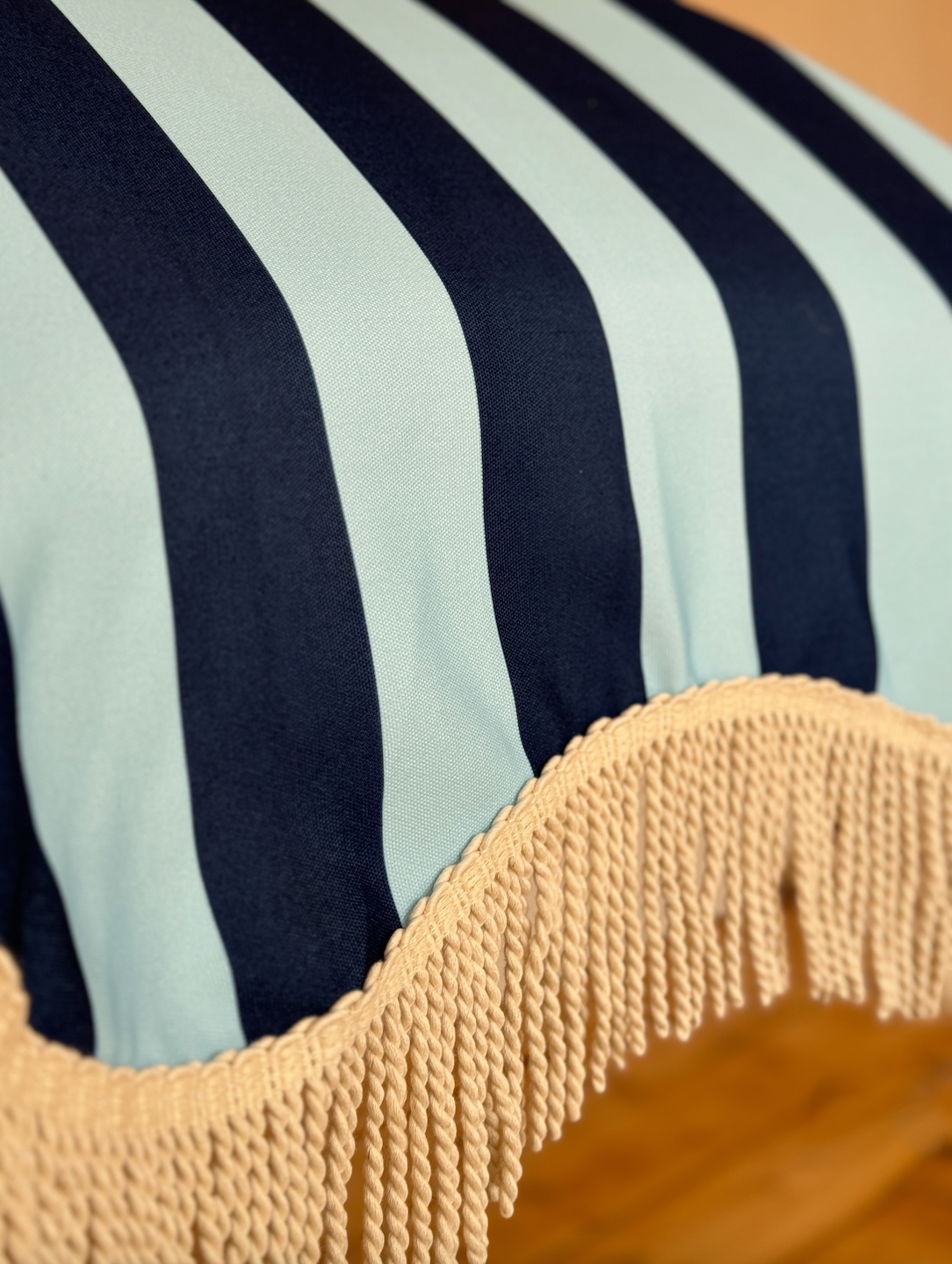 Mini Archie parasol with natural cotton fringing, wooden frame, adjustable positioning, perfect for children or park outings, includes matching carry bag