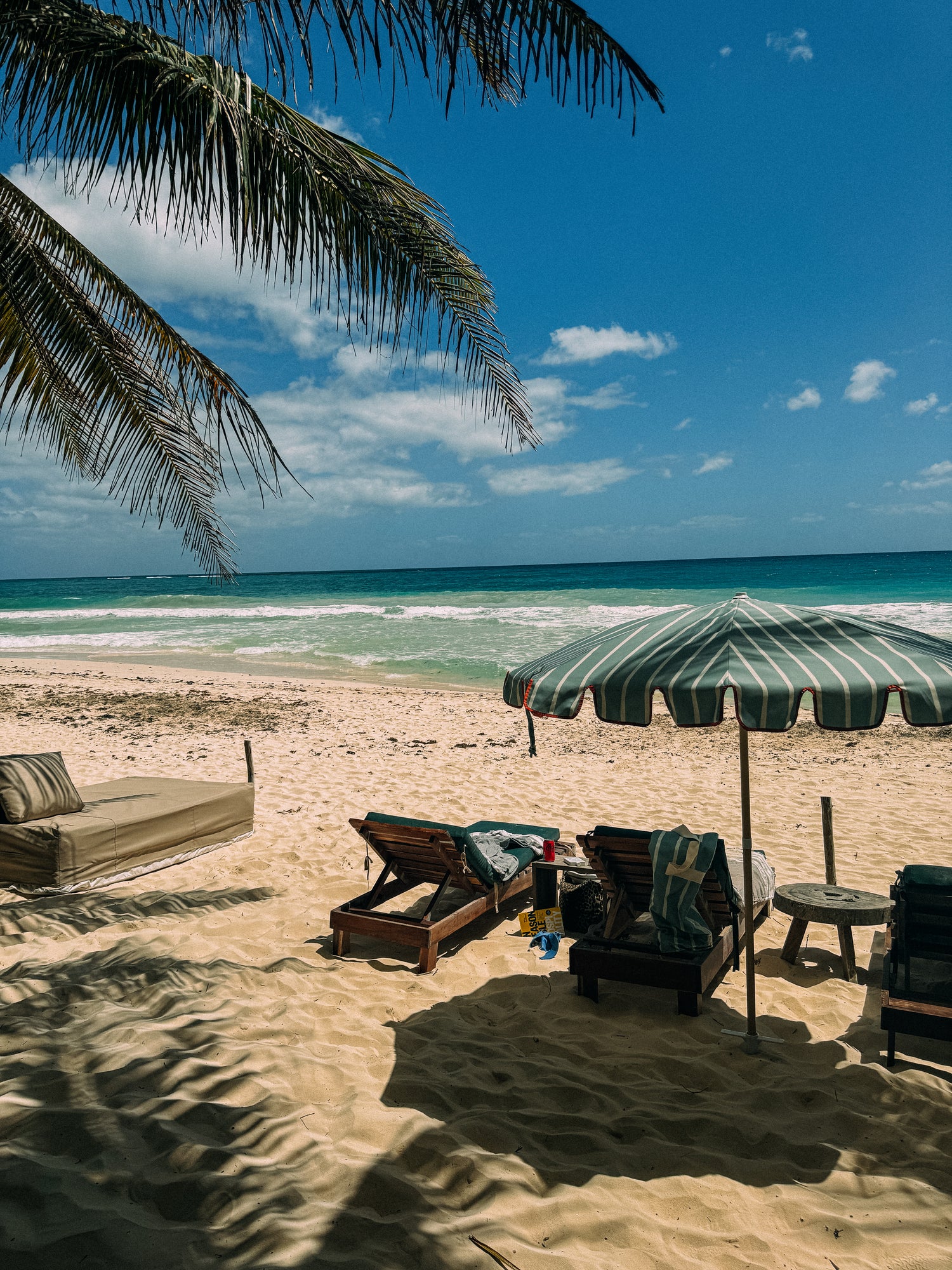 Freddie sage green and white striped parasol with orange-taped scallop edge and beech wood frame