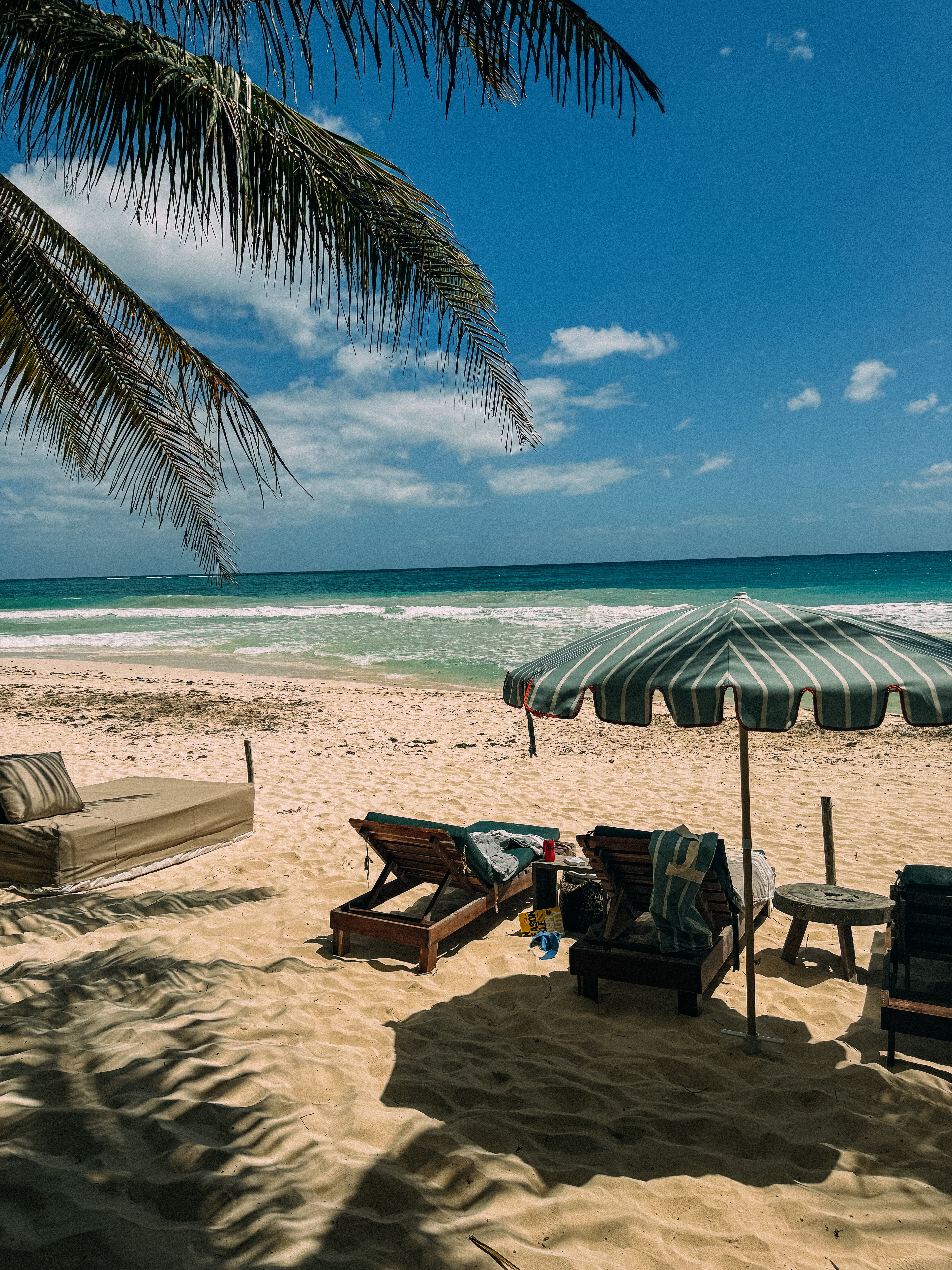 Freddie sage green and white striped parasol with orange-taped scallop edge and beech wood frame