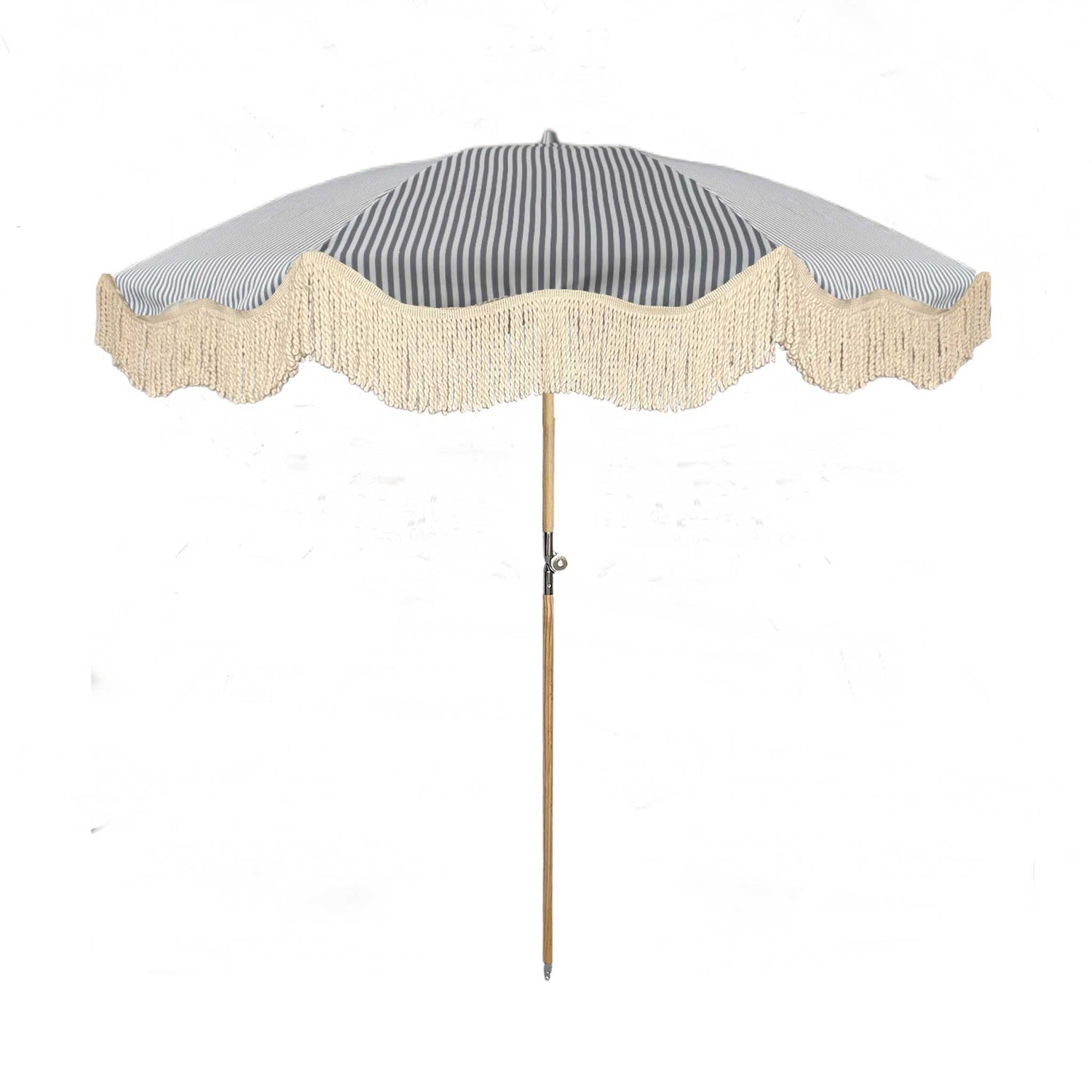 The Betty timeless chic parasol with natural cotton fringing, wooden frame pole, adjustable positioning, collapsible design, and matching canvas carry bag.
