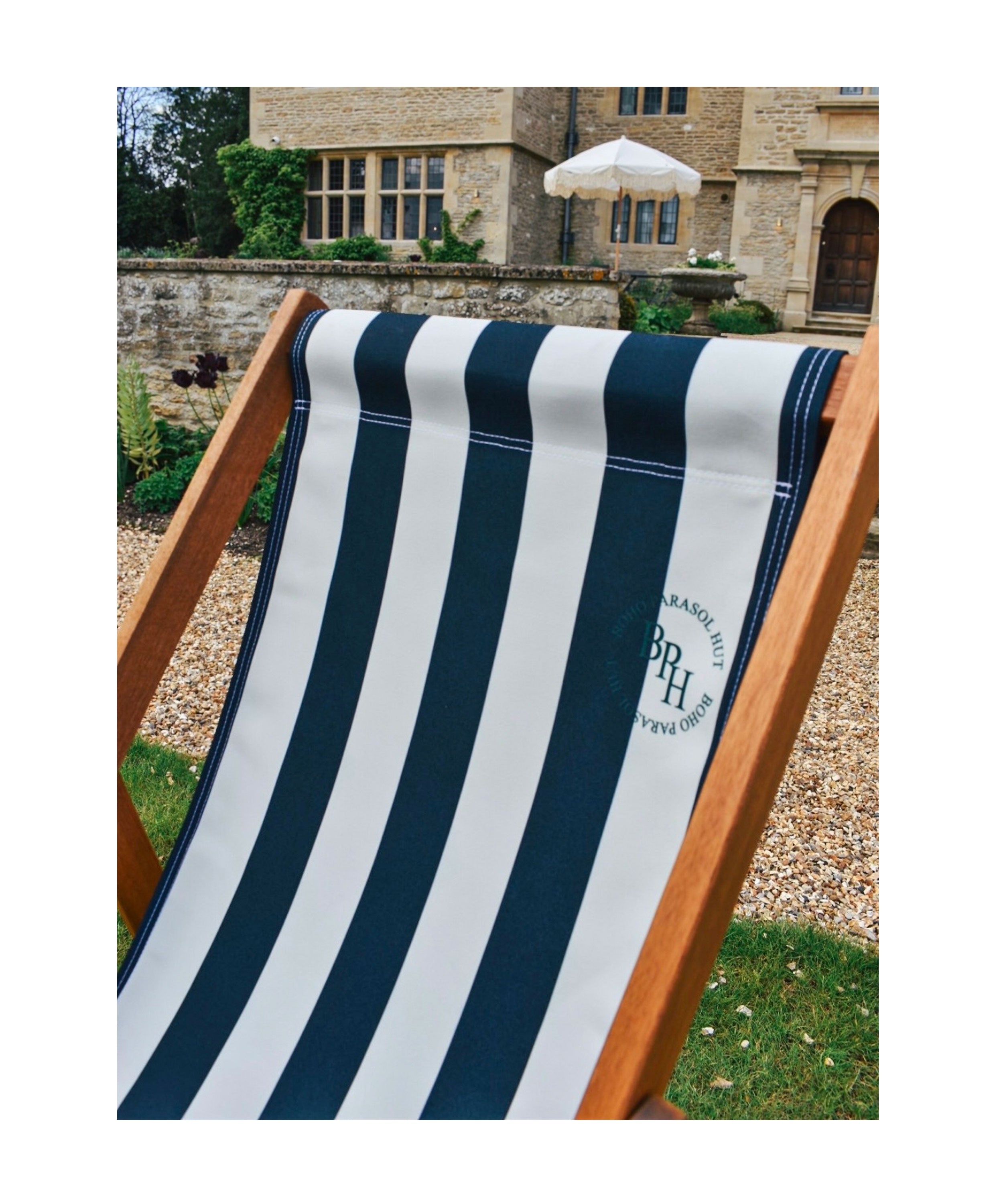 Henry deckchair in midnight blue stripes, crafted in the UK, offering a stylish and comfortable seating option for your outdoor space.