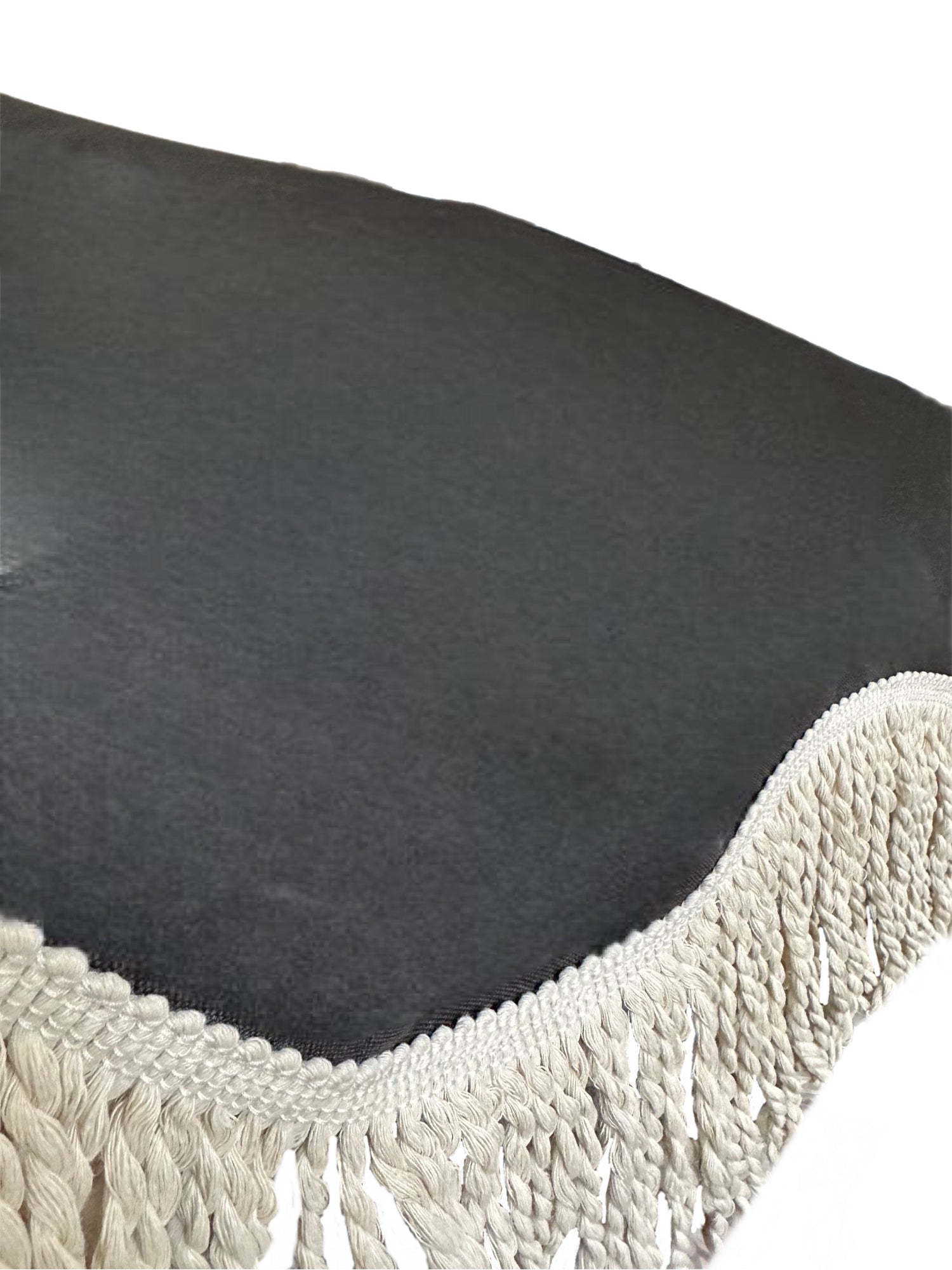 The Dorothy luxury black parasol with natural cotton fringing, wooden frame pole, adjustable positioning, collapsible design, signature logo panel, and matching carry bag."