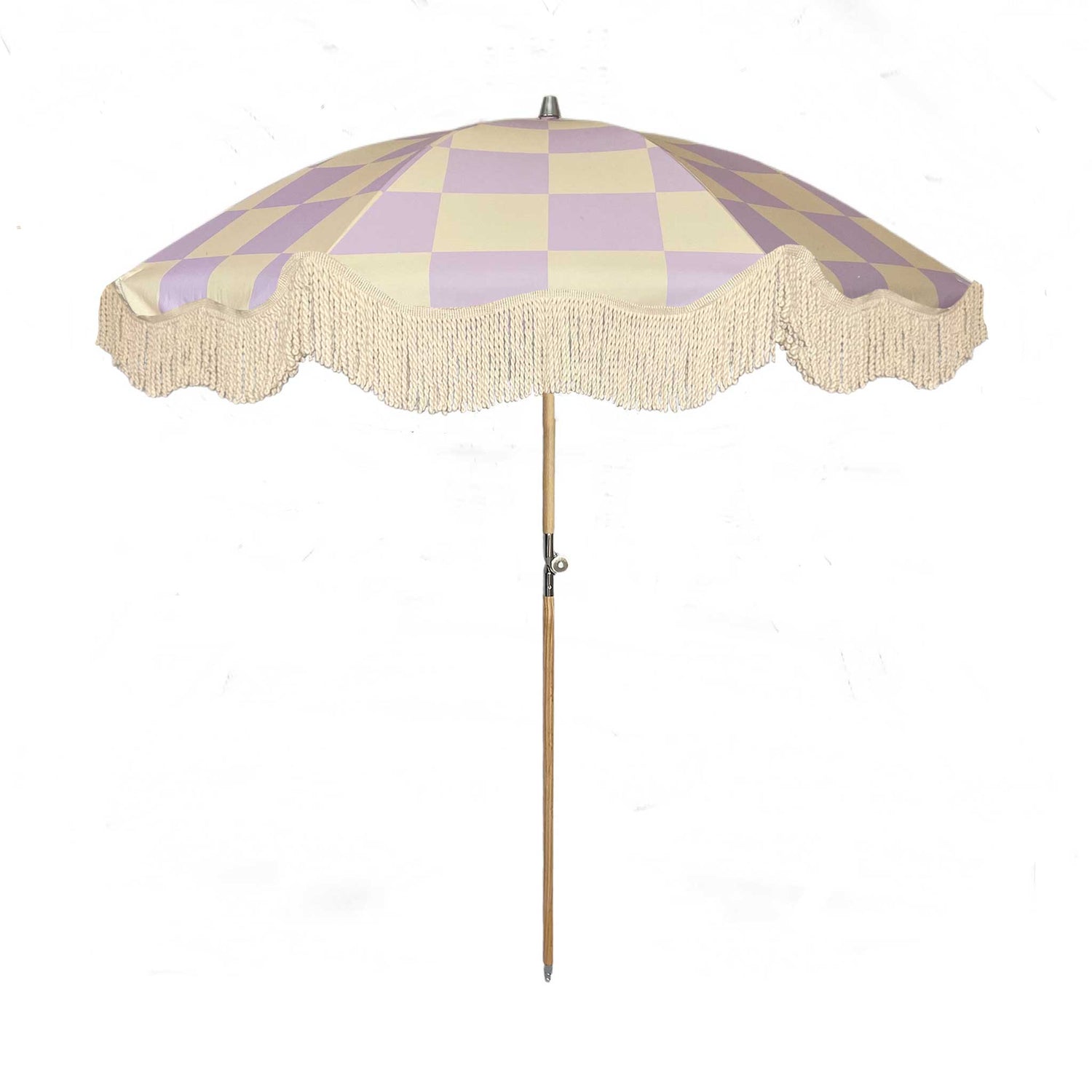 The Mabel boho chic parasol with lilac and cream checkerboard print, natural cotton fringing, adjustable wooden frame pole, collapsible design, and matching canvas carry bag.