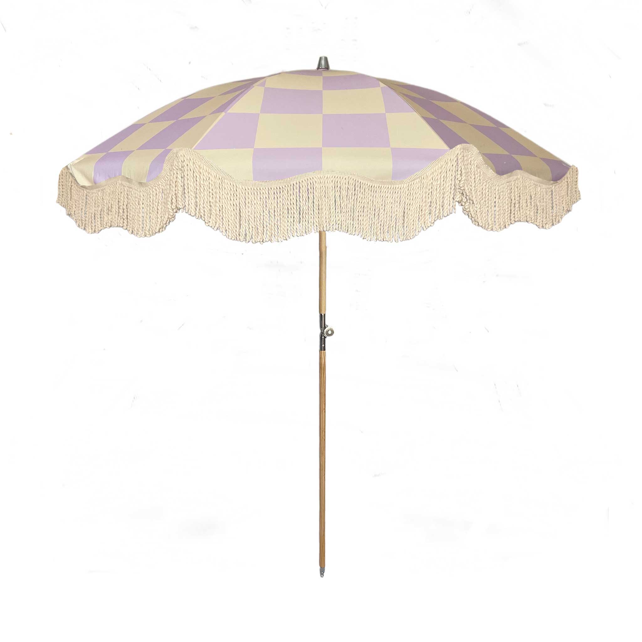 The Mabel boho chic parasol with lilac and cream checkerboard print, natural cotton fringing, adjustable wooden frame pole, collapsible design, and matching canvas carry bag.