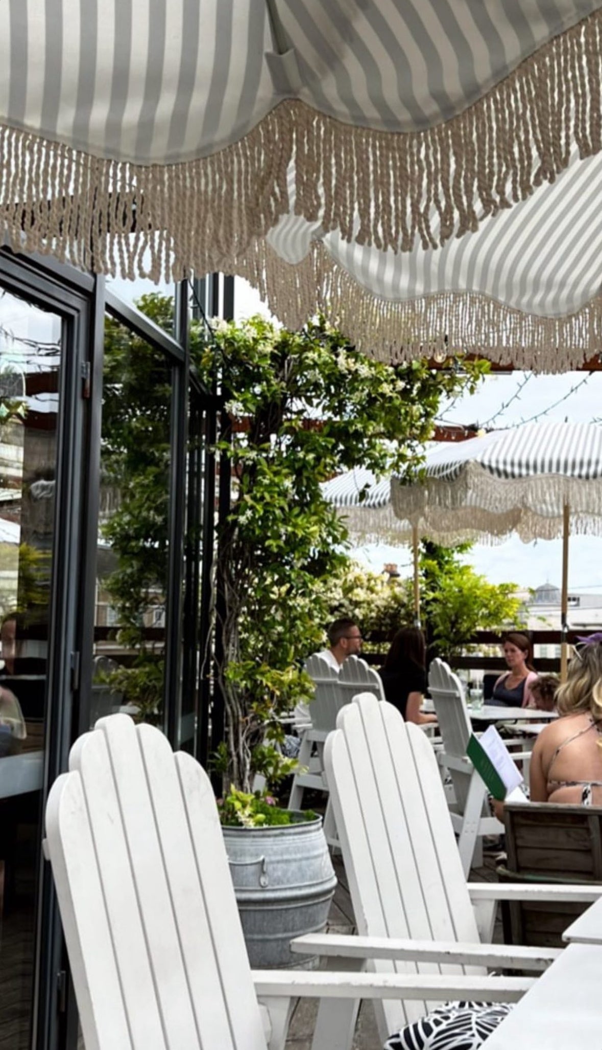 Striped parasol umbrella fringing. Trade parasol umbrellas