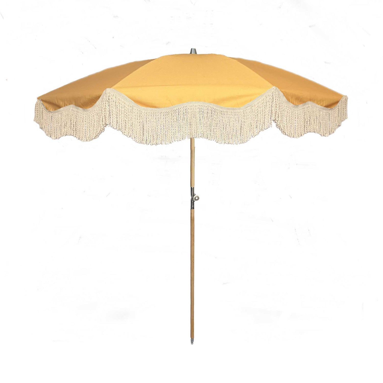 on Sol yellow parasol with natural cotton fringing, featuring a wooden frame and adjustable positioning, perfect for gardens, patios, and outdoor events.