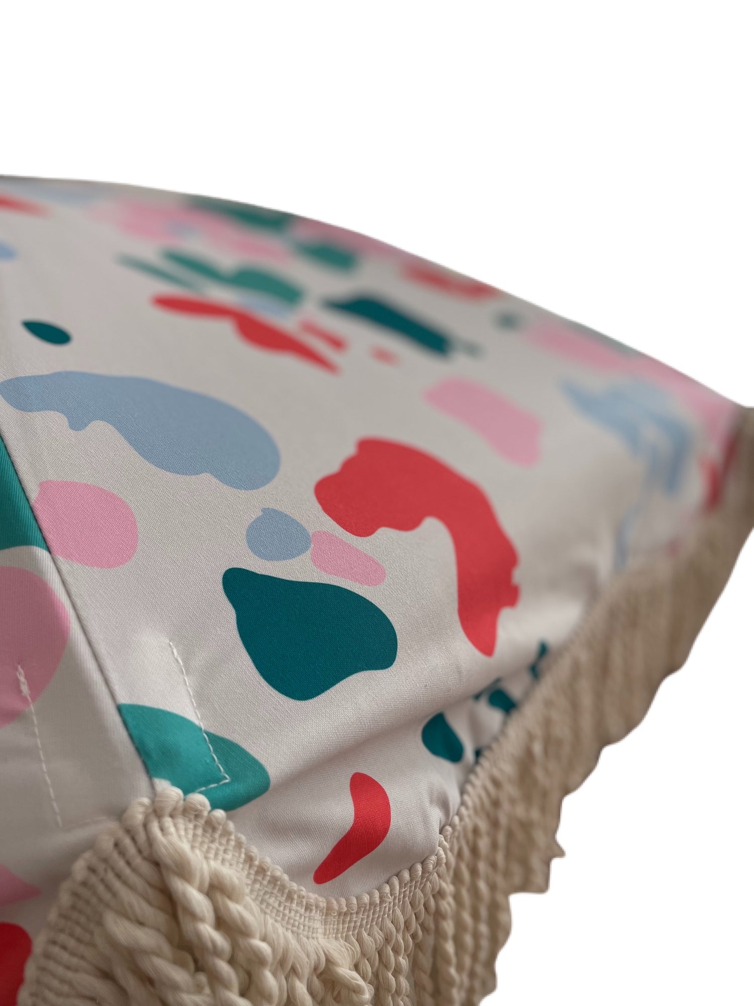 The Florence boho chic parasol with vibrant floral pattern, natural cotton fringing, adjustable wooden frame pole, collapsible design, and matching canvas carry bag.