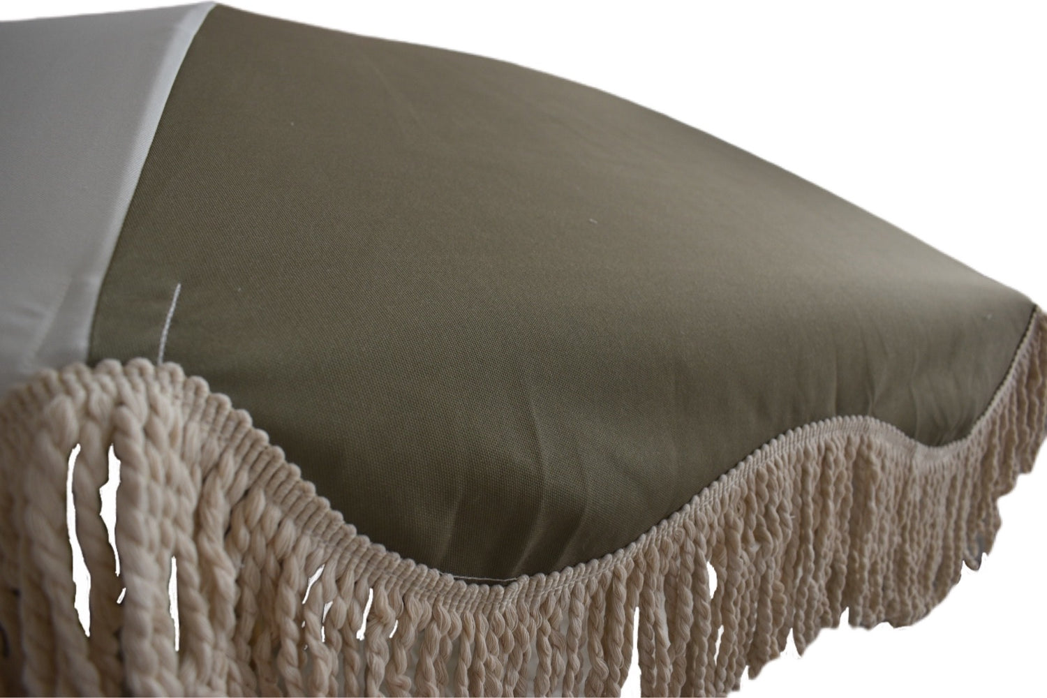 The Salma timeless chic parasol with natural cotton fringing, wooden frame pole, adjustable positioning, collapsible design, and matching canvas carry bag.