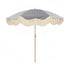 The Betty timeless chic parasol with natural cotton fringing, wooden frame pole, adjustable positioning, collapsible design, and matching canvas carry bag.