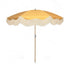 on Sol yellow parasol with natural cotton fringing, featuring a wooden frame and adjustable positioning, perfect for gardens, patios, and outdoor events.